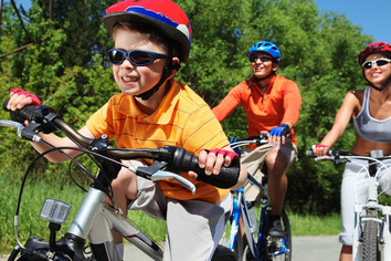 Happy kid riding bike