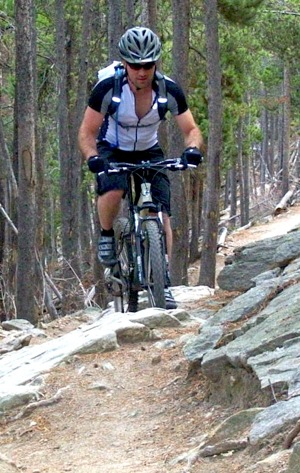 Climbing rocks on a mountain bike