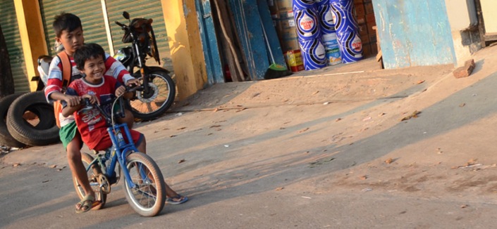 Kids on bikes in Asia