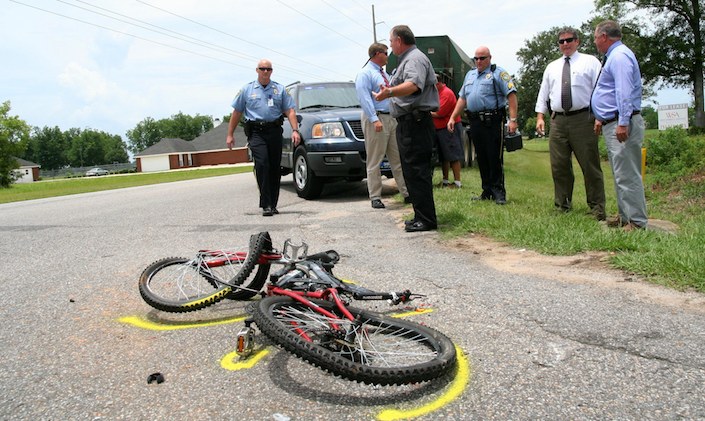 Bicycle accident aftermath with police investigators