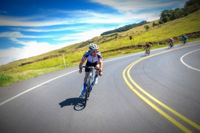 Descend fast downhill corners on road bike
