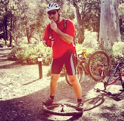 Fixing a bent bicycle wheel in the bush