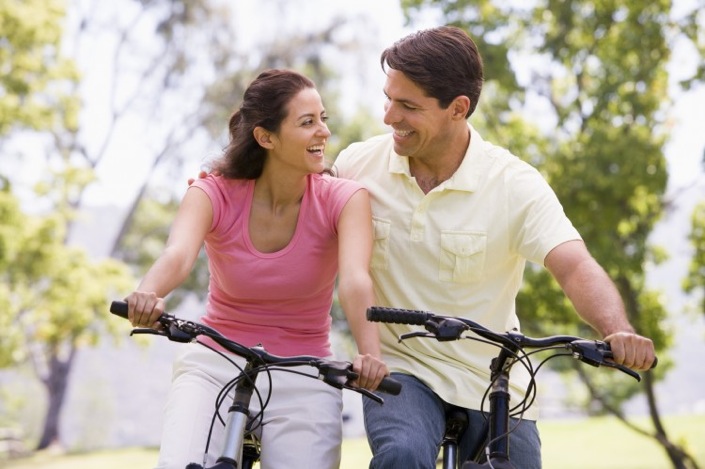 A happy bike riding couple