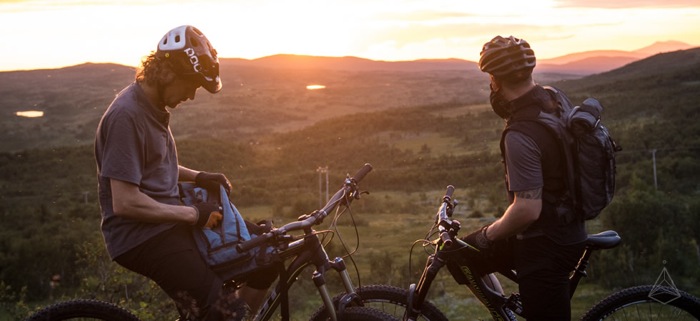 Mountain bikers wearing hydration packs