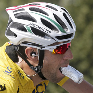 Cyclist with a roll in mouth