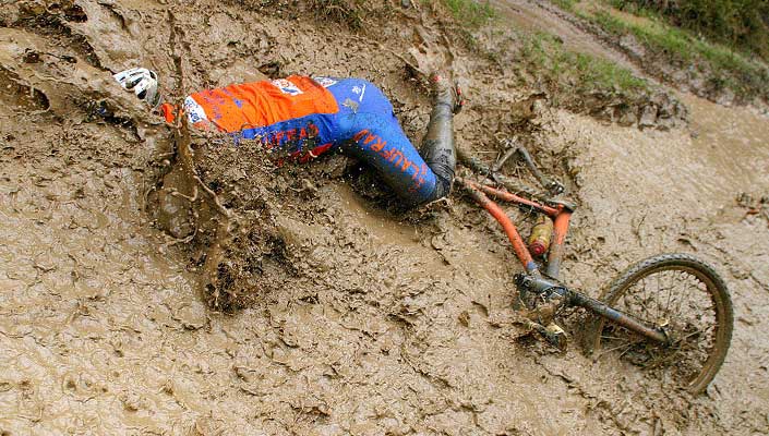  mountain bike rider crashes full-body into mud bath