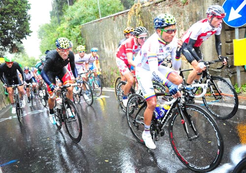 Cycling professionals race in the rain