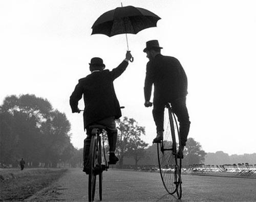 Ride in the rain with an umbrella