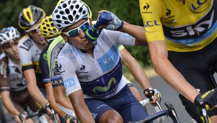 Nairo Quintana takes a drink from a water bottle during the Tour de France race