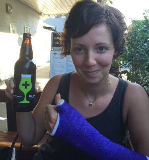 Injured Jordana has a cast and a beer