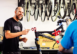 Smiling happy bike mechanic