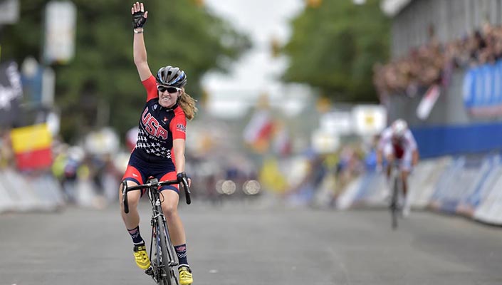 Female cyclist Emma White waving to all her male fans