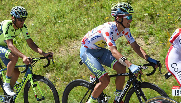 Rafal Majka wears the TdF polka dot jersey (French: maillot à pois rouges)