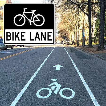 Bike lane sign and surface markings