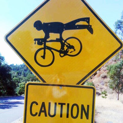 Caution: Superman cyclist ahead