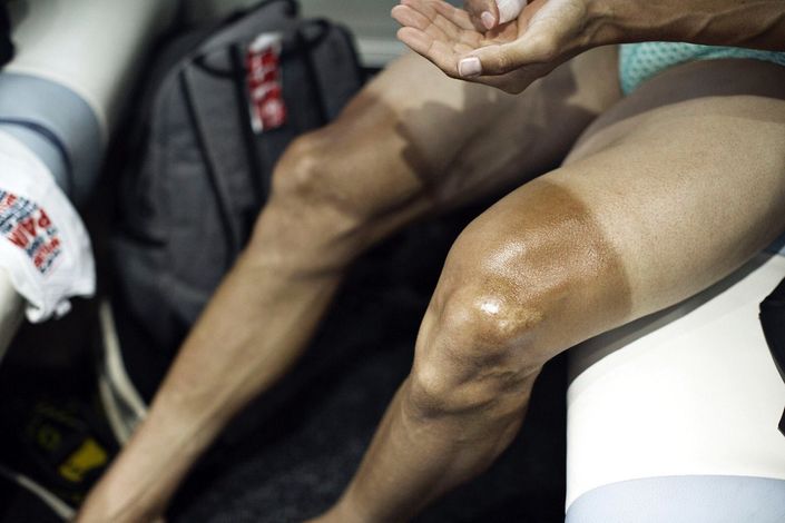 Shaved legs of Martin Elminger (IAM Cycling) are ready for a massage