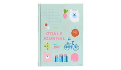 Write down your goals in a kikki.K A5 Goals Journal