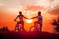 Sunset bike ride holding hands